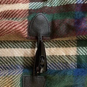 Women’s plaid shawl cape with toggle.